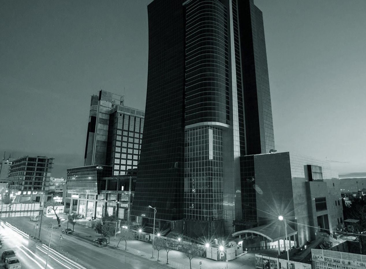 Qaiwan Tower at dusk, light trails below